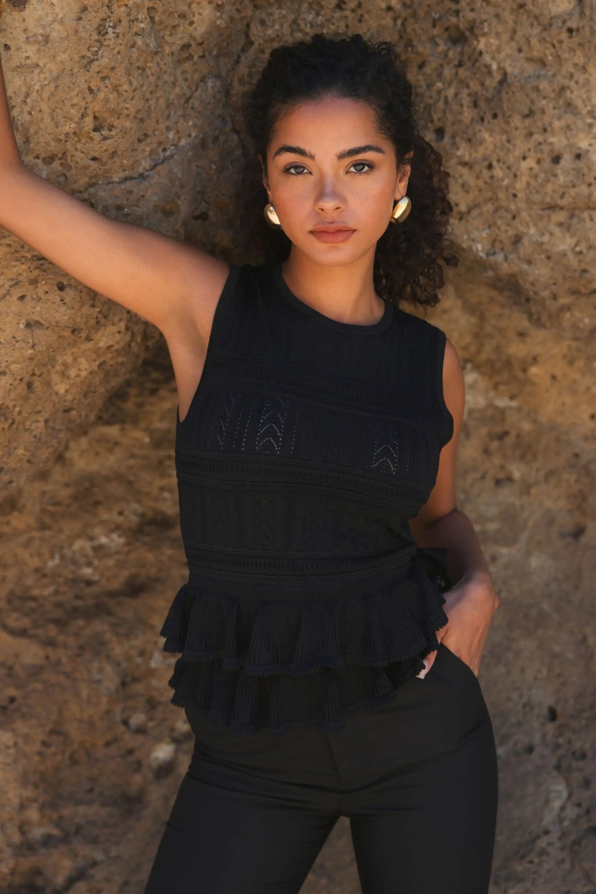 Black Sleeveless High Neck Knit Top With Ruffle Hem - FINAL SALE